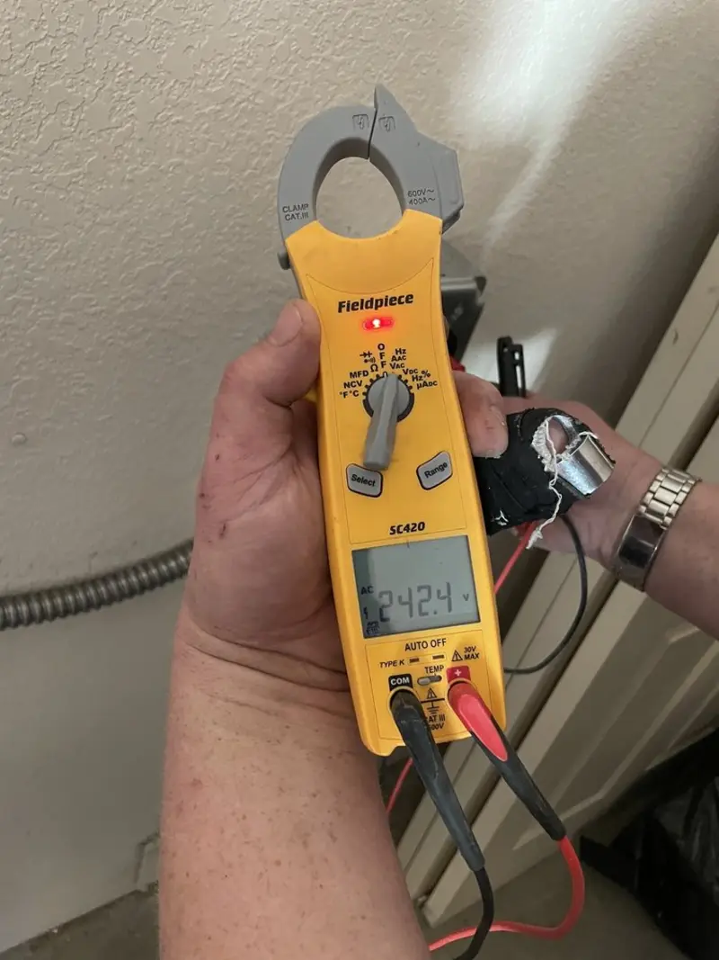 Voltage testing with clamp meter during Outlet Installation in Orange City